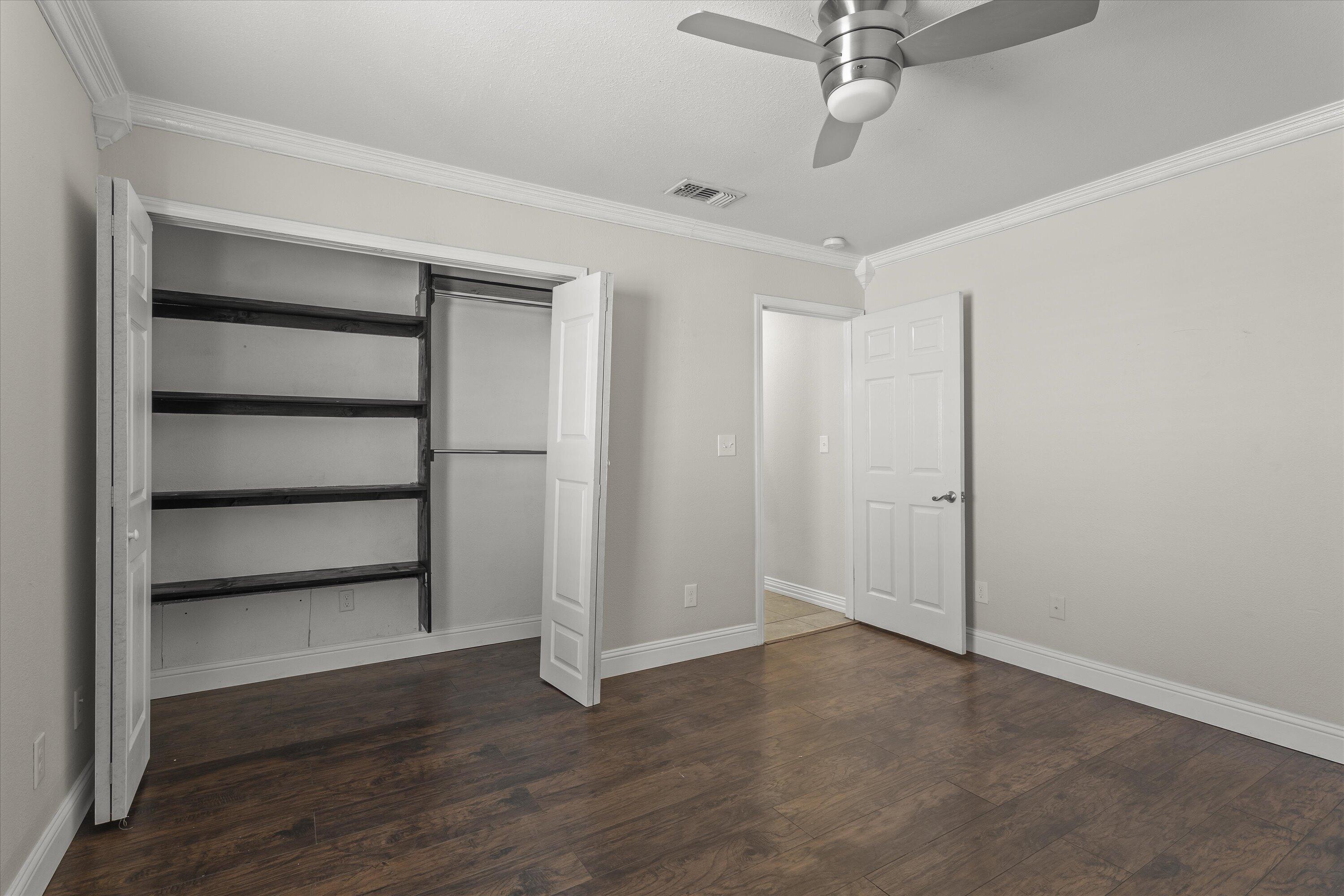 3131 North Alamo Road Levelland, TX 79336 - Photo 19 of 32 a view of an empty room with a window