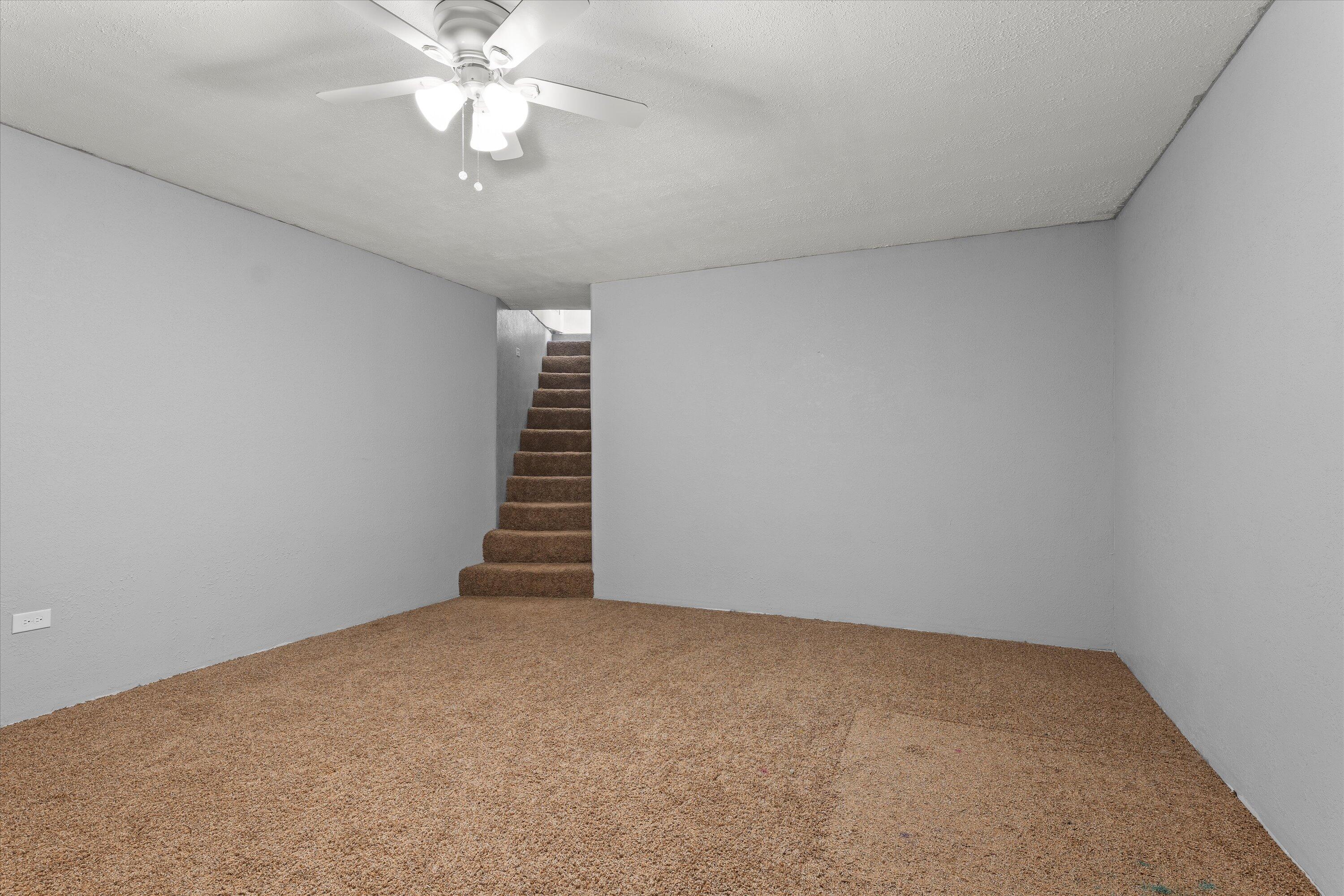3131 North Alamo Road Levelland, TX 79336 - Photo 21 of 32 a view of an empty room with a window