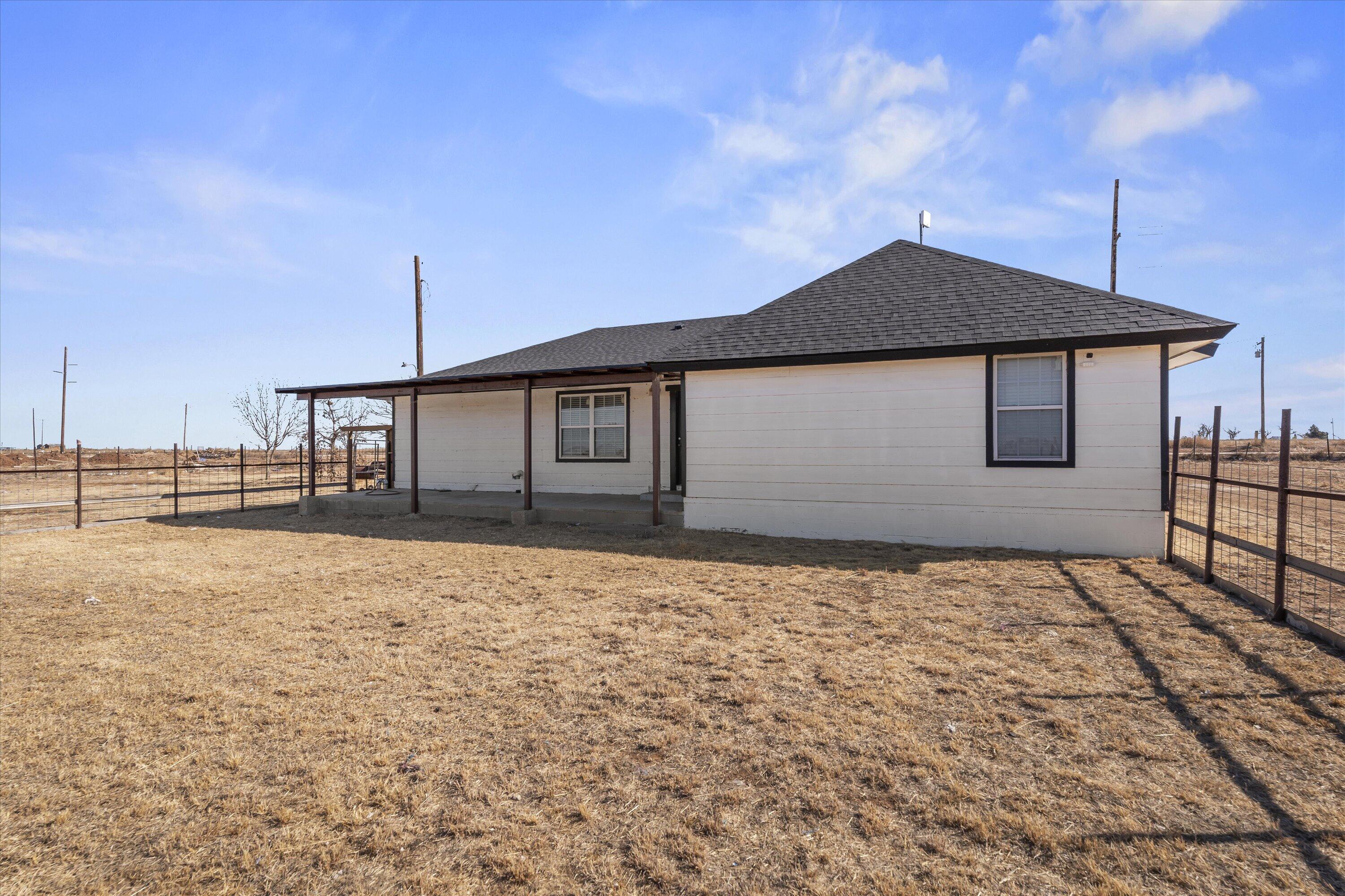 3131 North Alamo Road Levelland, TX 79336 - Photo 26 of 32 a front view of a house with a yard