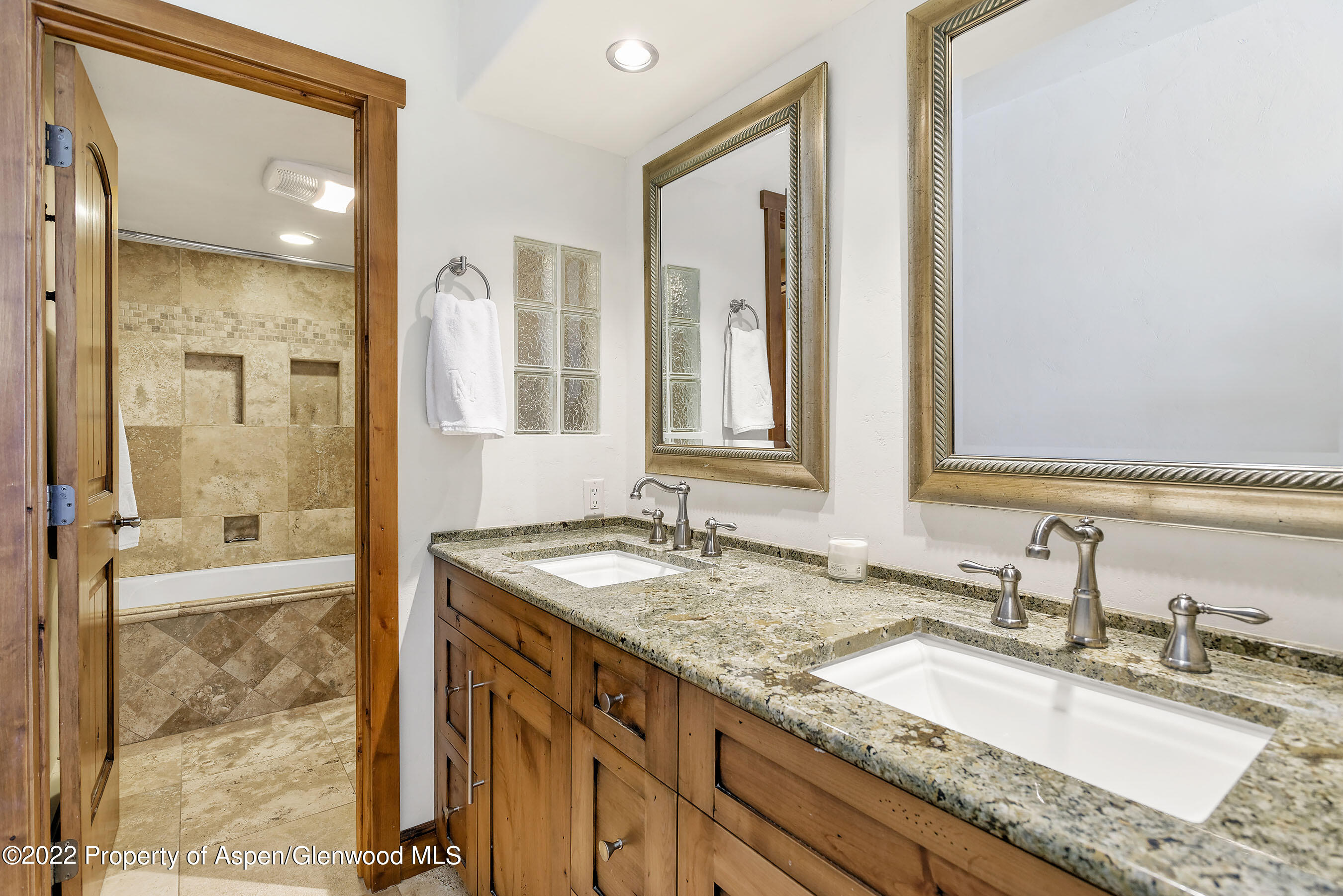 232 Meadow Ranch Road Snowmass Village, CO 81615 - Photo 11 of 18 a bathroom with a granite countertop sink and a mirror