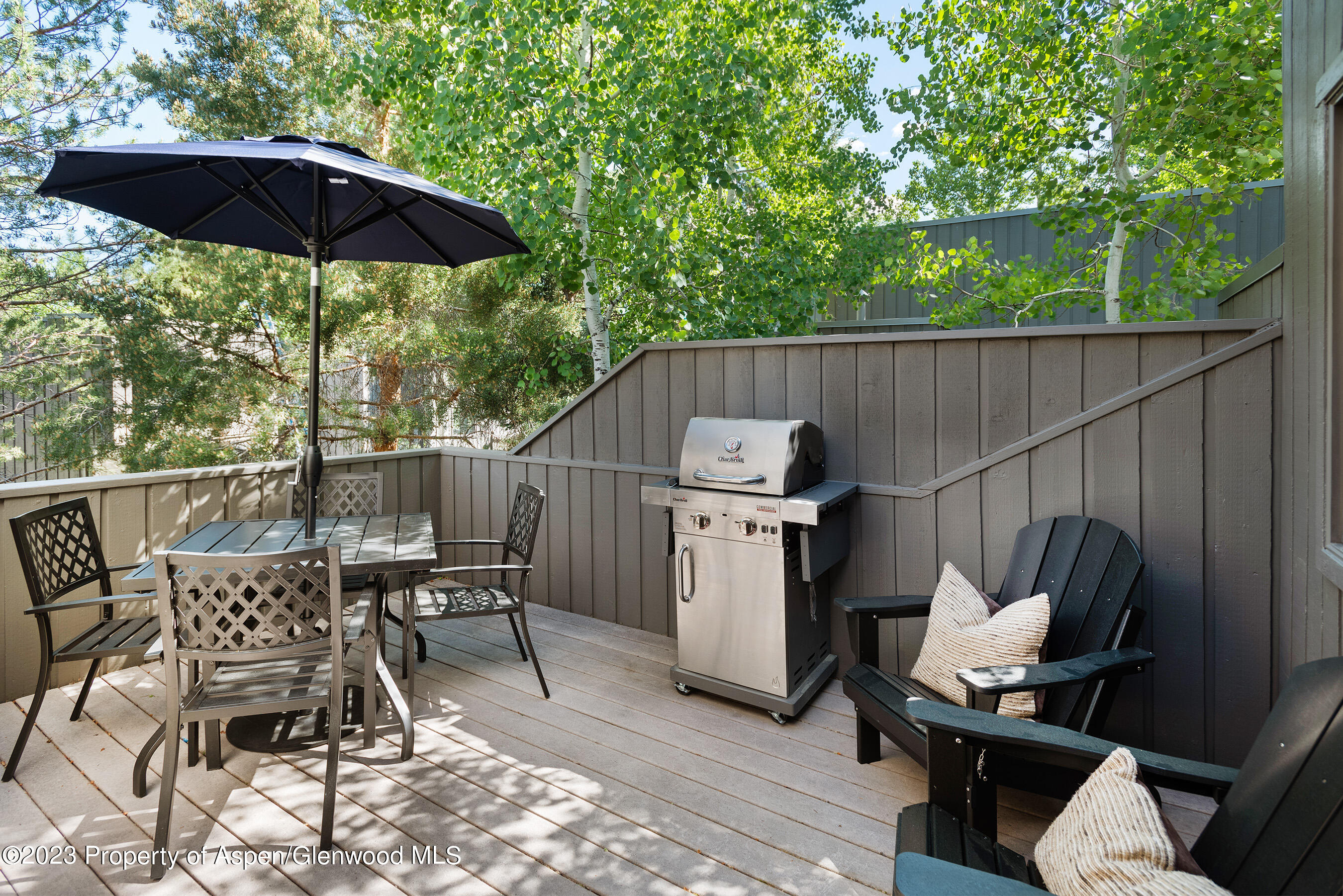 232 Meadow Ranch Road Snowmass Village, CO 81615 - Photo 4 of 18 an outdoor space with furniture and umbrella