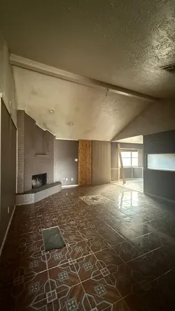 a view of empty room with windows and dryer