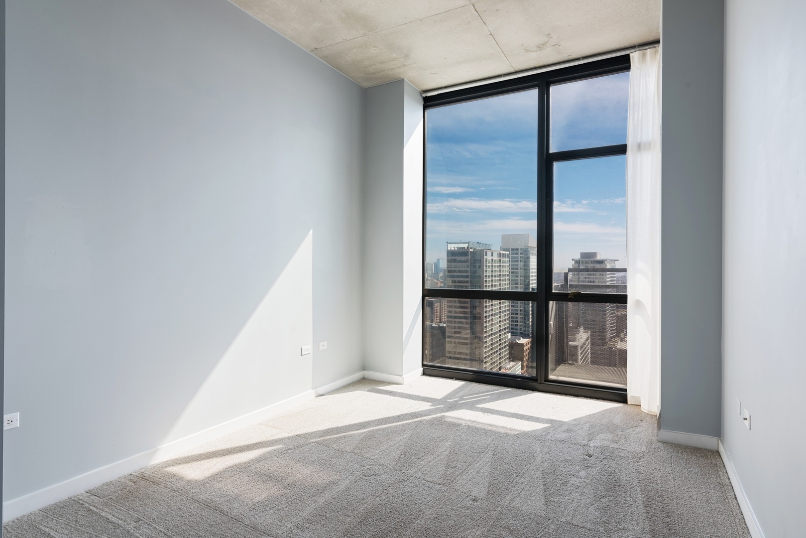 235 West Van Buren Street, Unit 2905 Chicago, IL 60607 - Photo 7 of 18 a view of a room with a large window