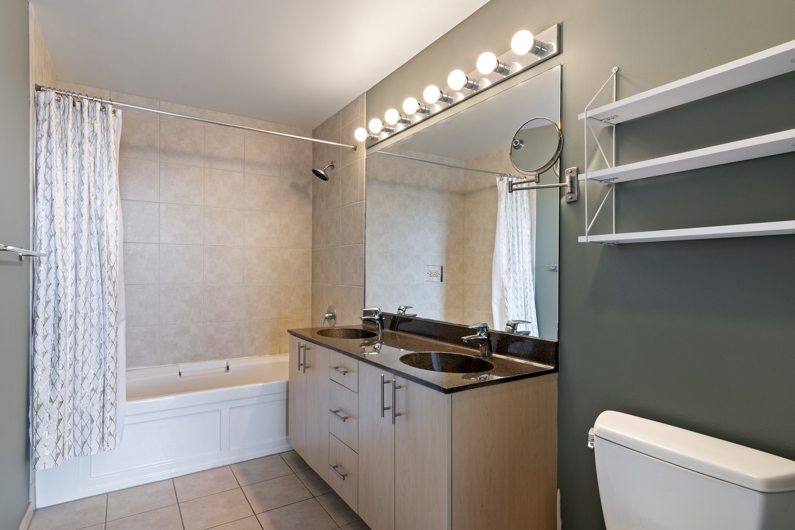 235 West Van Buren Street, Unit 2905 Chicago, IL 60607 - Photo 9 of 18 a bathroom with a granite countertop sink a toilet and shower