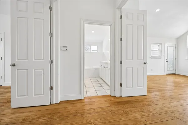 a view of a livingroom with wooden floor