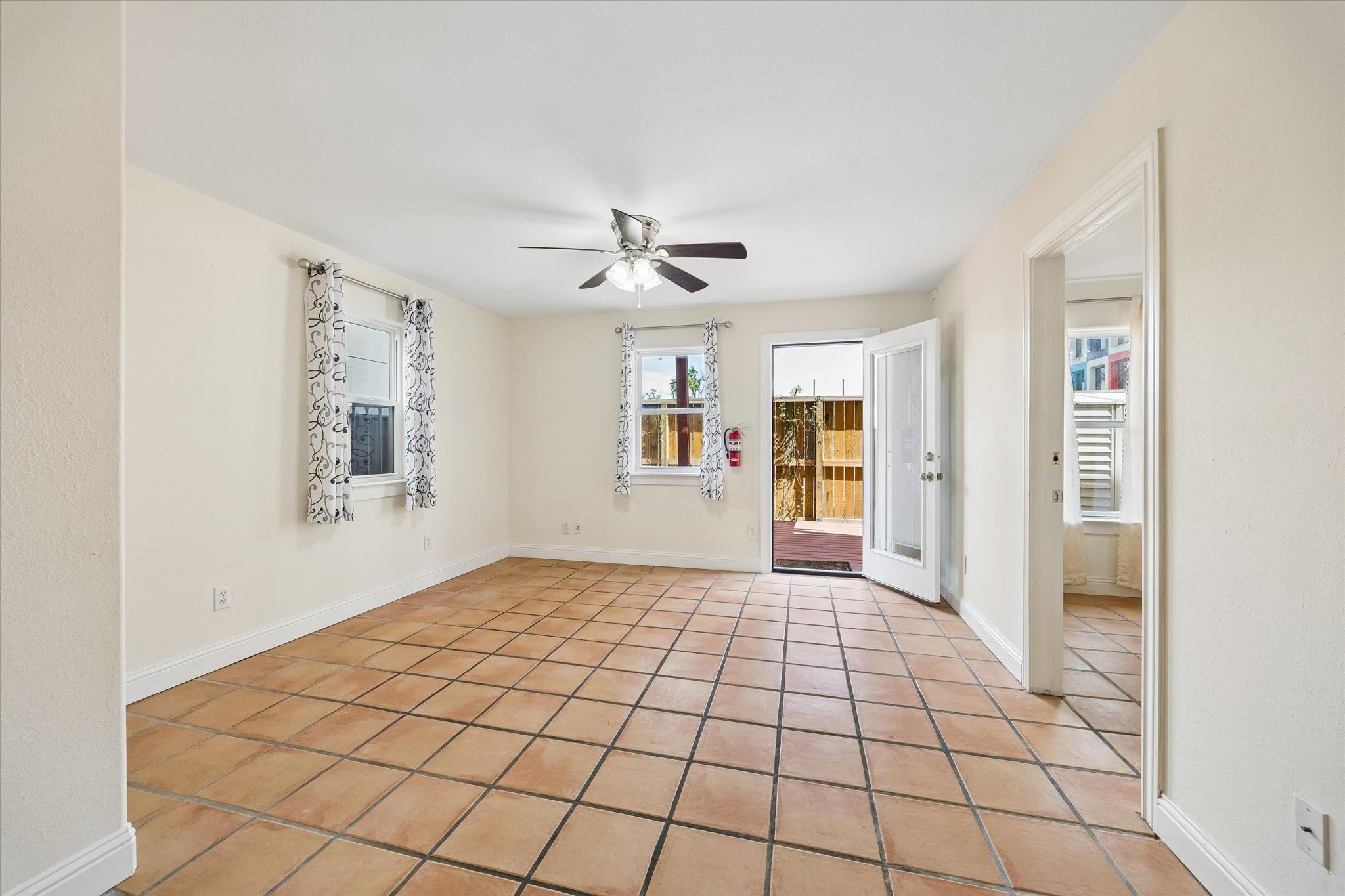4011 Garrott Street Houston, TX 77006 - Photo 2 of 19 a view of an empty room with window and cabinet