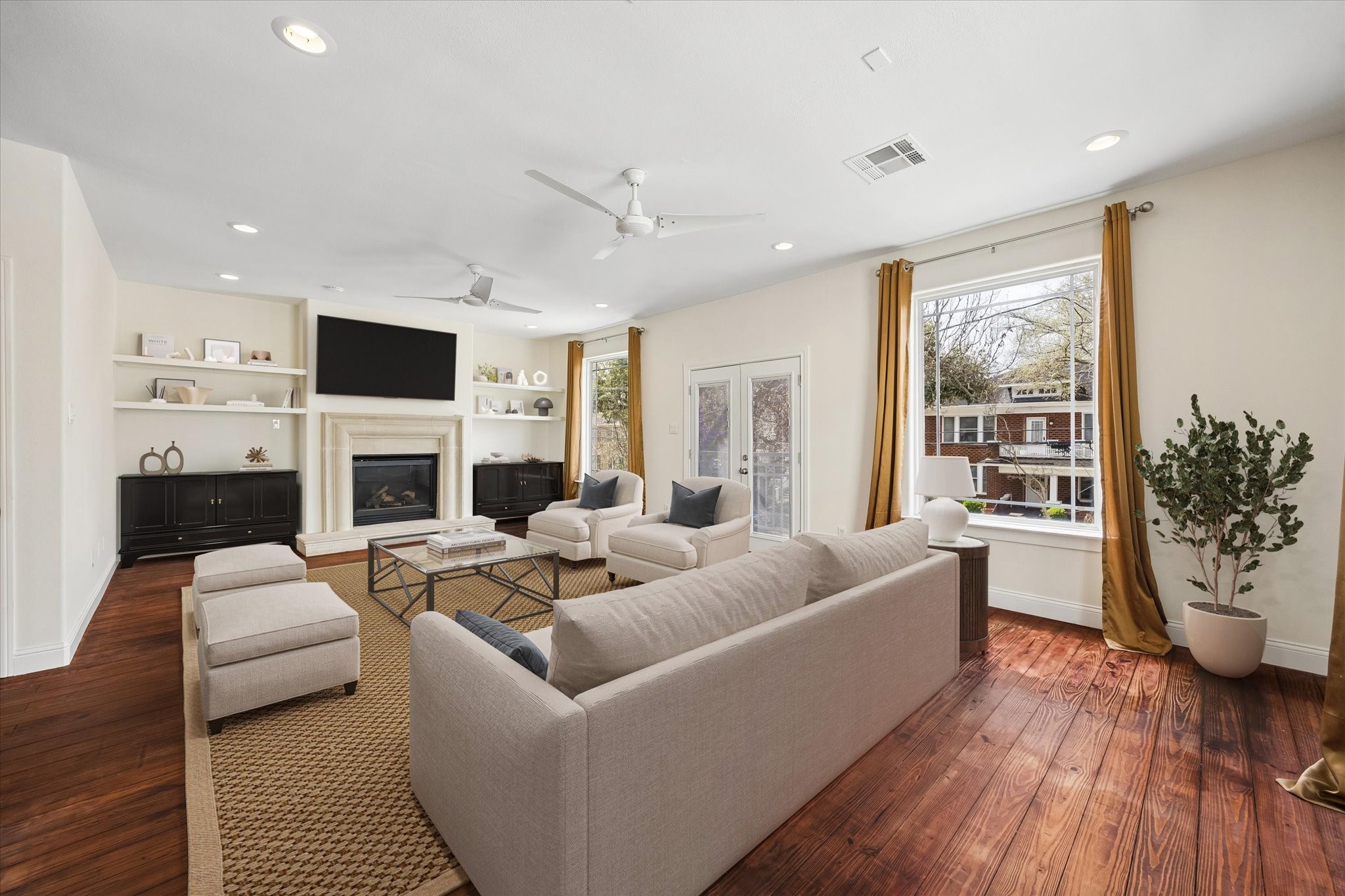 4011 Garrott Street Houston, TX 77006 - Photo 5 of 19 a living room with fireplace furniture and a large window