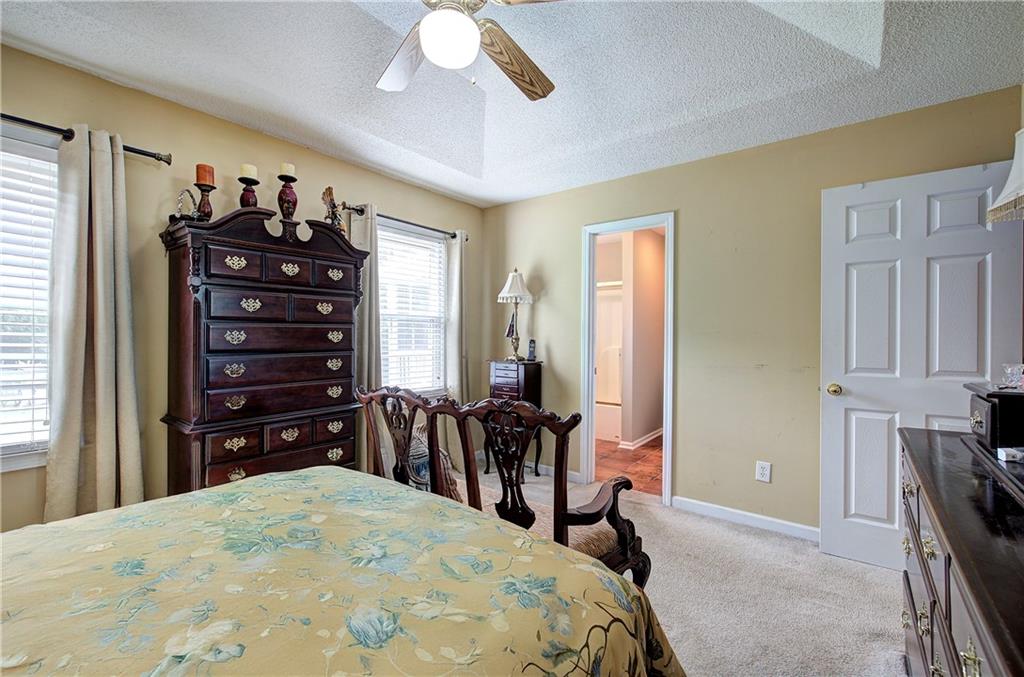 218 Gilreath Road Southeast Cartersville, GA 30121 - Photo 15 of 27 a bedroom with a bed and wooden floor