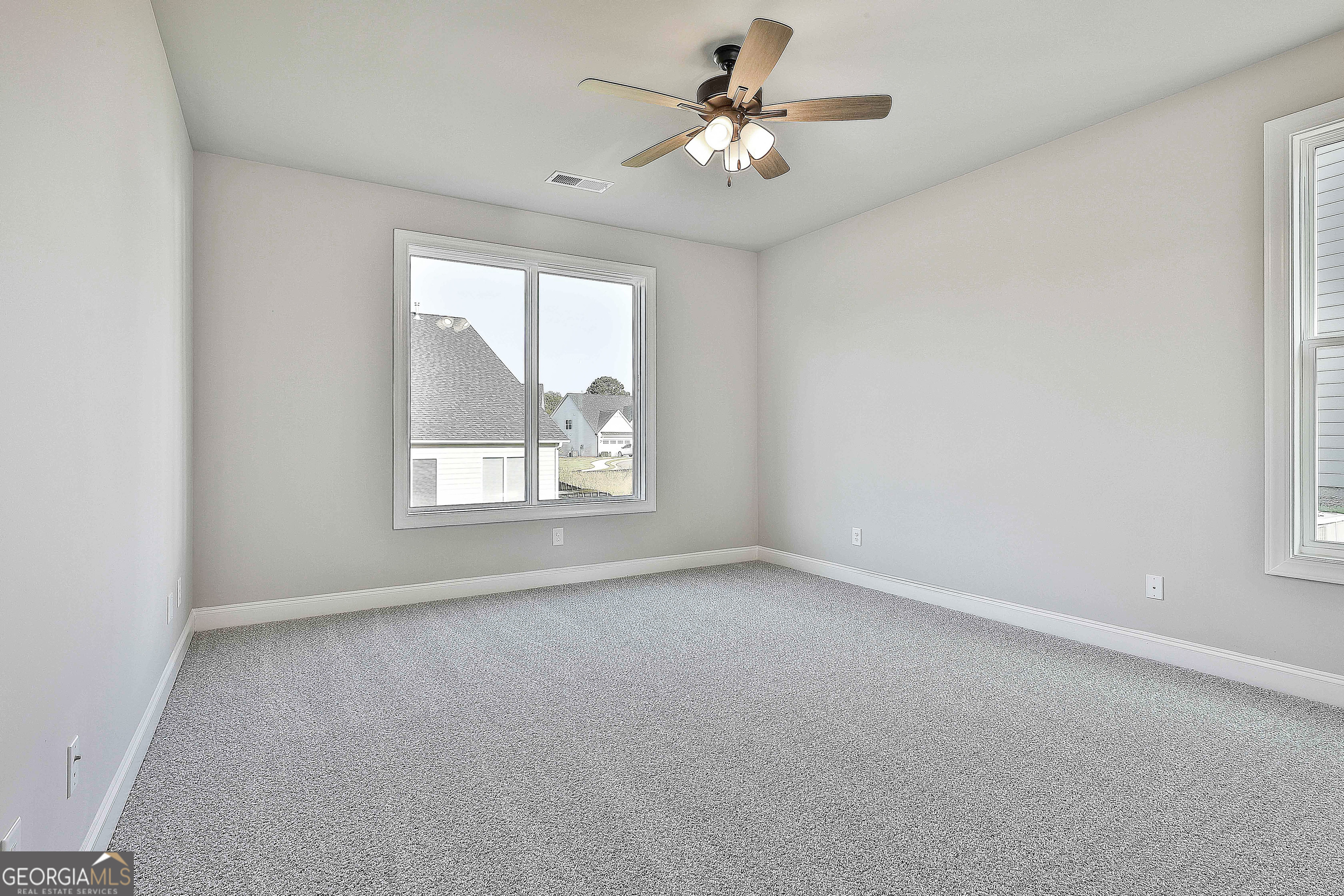 6 Leverett Drive, Unit 17 Newnan, GA 30265 - Photo 19 of 35 an empty room with windows and fan