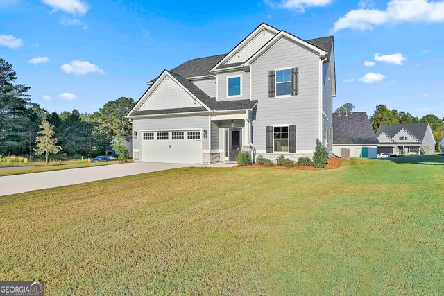 a front view of house with yard and swimming pool