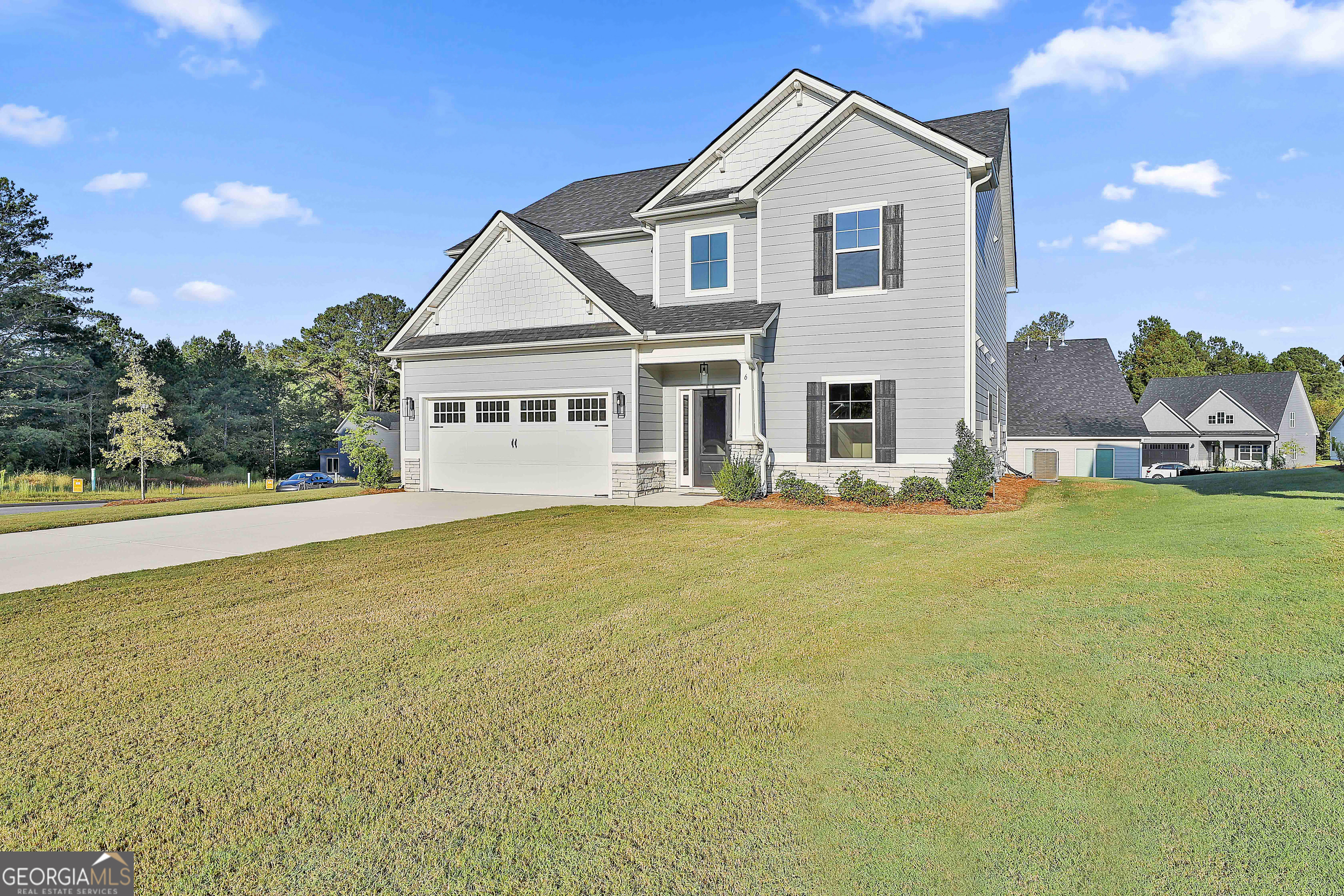 6 Leverett Drive, Unit 17 Newnan, GA 30265 - Photo 2 of 35 a front view of house with yard and swimming pool