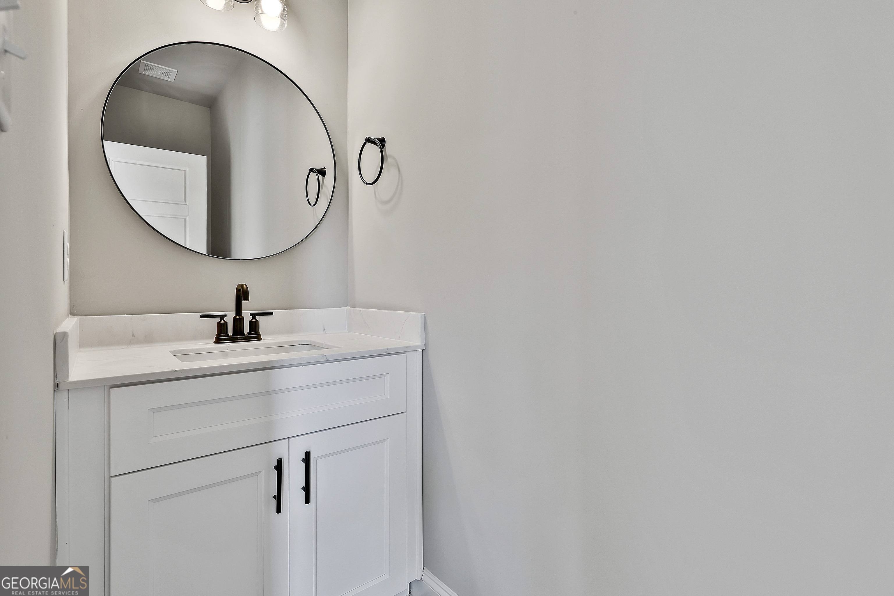 6 Leverett Drive, Unit 17 Newnan, GA 30265 - Photo 24 of 35 a bathroom with a sink and a mirror