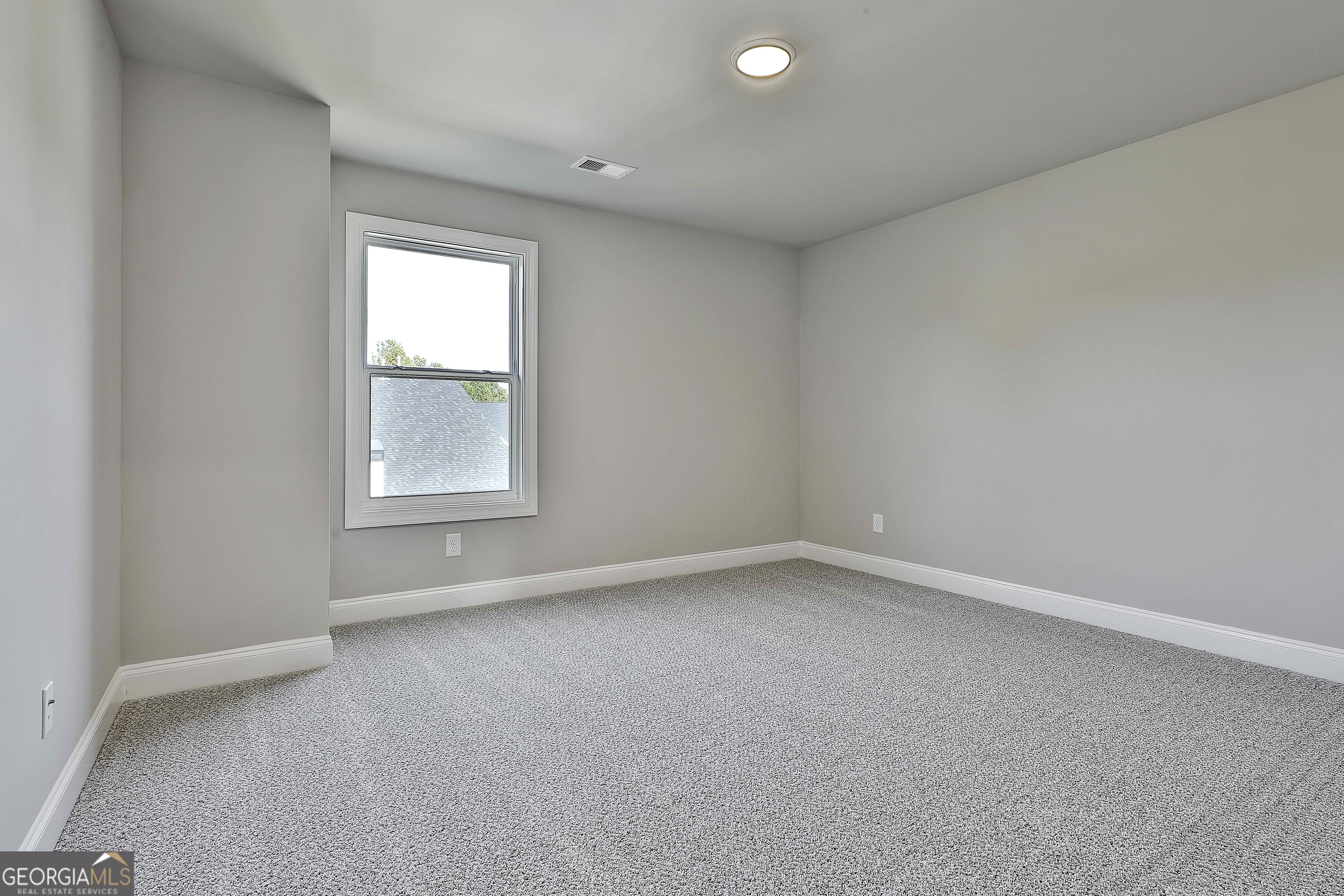 6 Leverett Drive, Unit 17 Newnan, GA 30265 - Photo 29 of 35 an empty room with a window