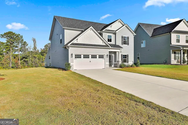 a front view of a house with a yard
