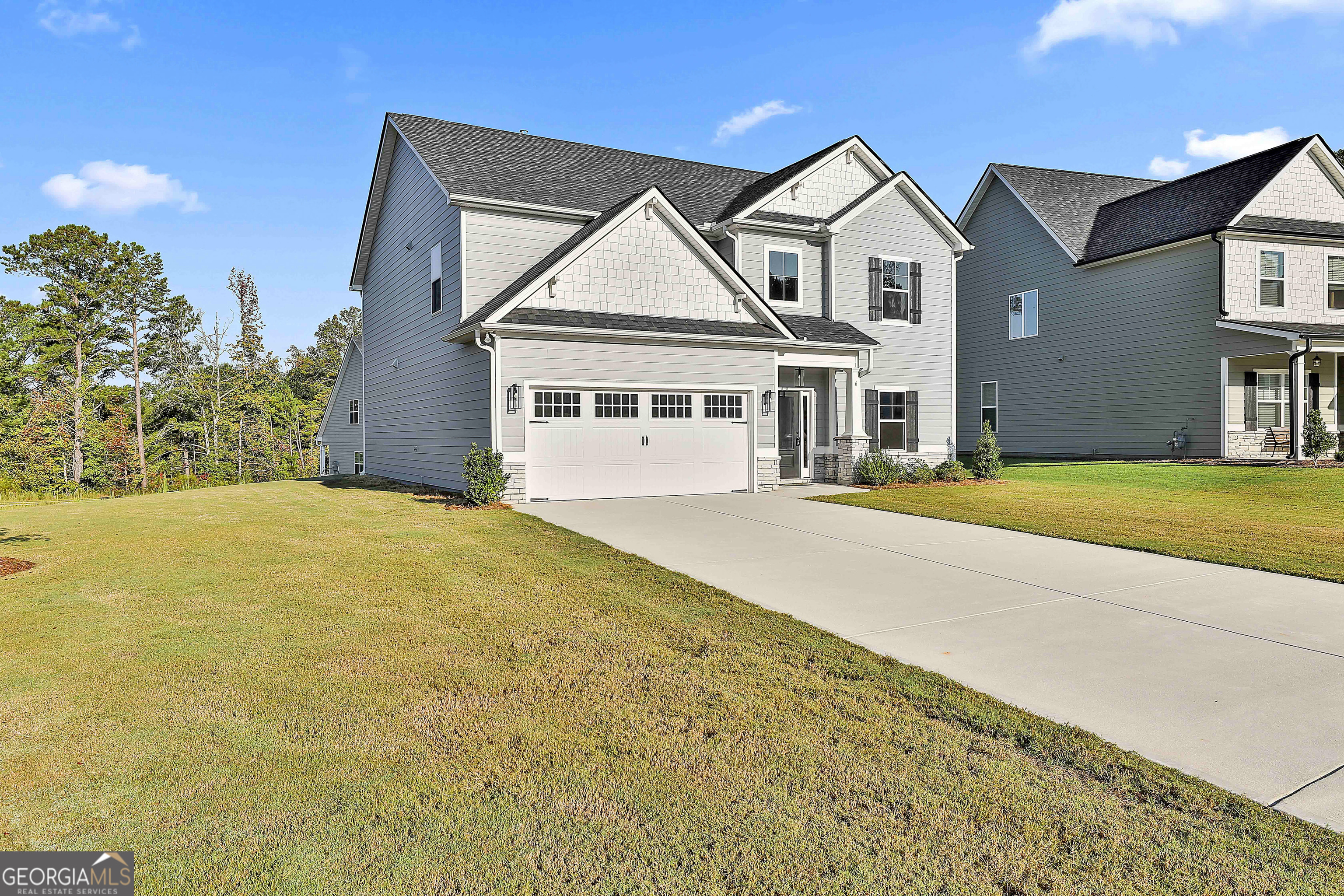 6 Leverett Drive, Unit 17 Newnan, GA 30265 - Photo 3 of 35 a front view of a house with a yard
