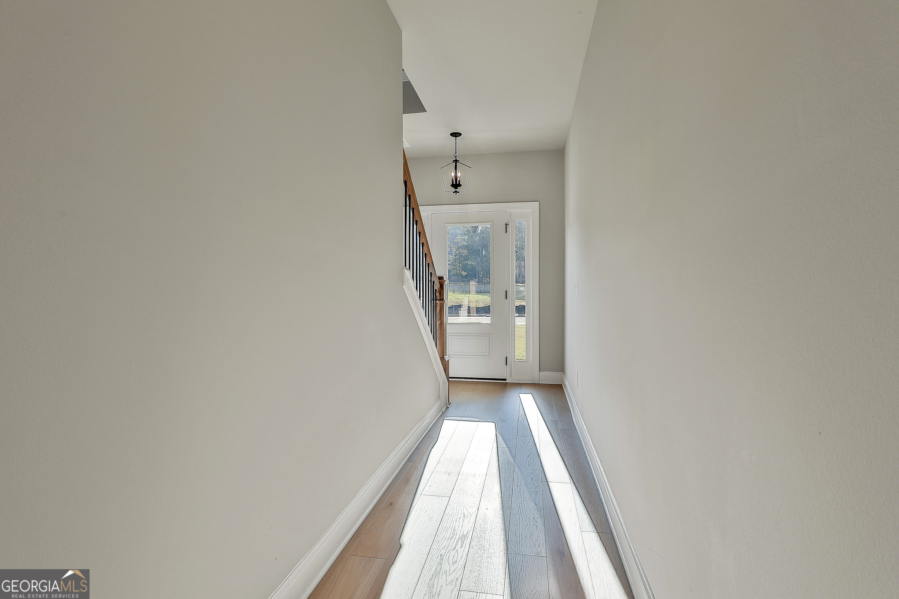 6 Leverett Drive, Unit 17 Newnan, GA 30265 - Photo 6 of 35 a view of a hallway with wooden floor