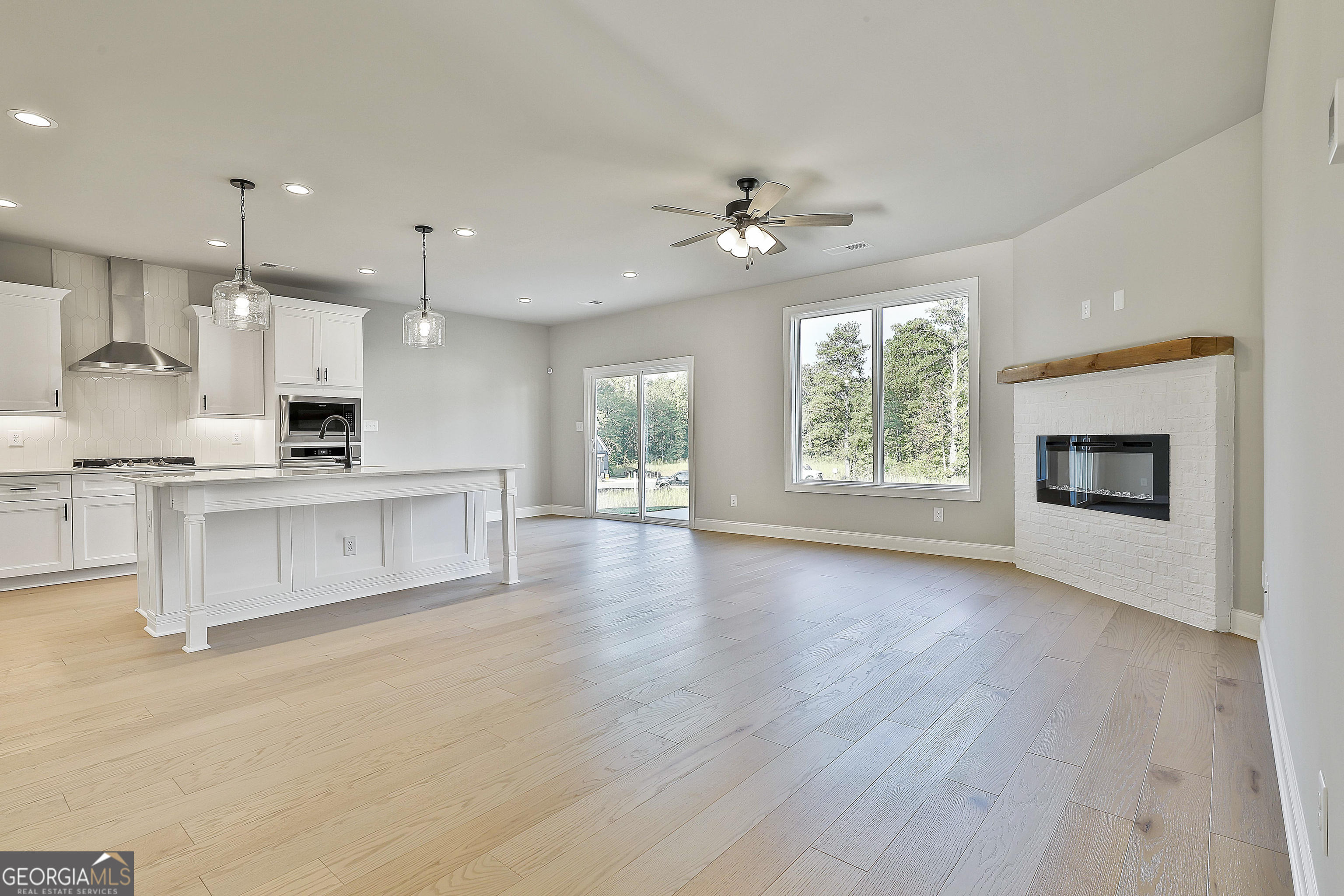 6 Leverett Drive, Unit 17 Newnan, GA 30265 - Photo 7 of 35 a view of kitchen with granite countertop stove top oven and cabinets