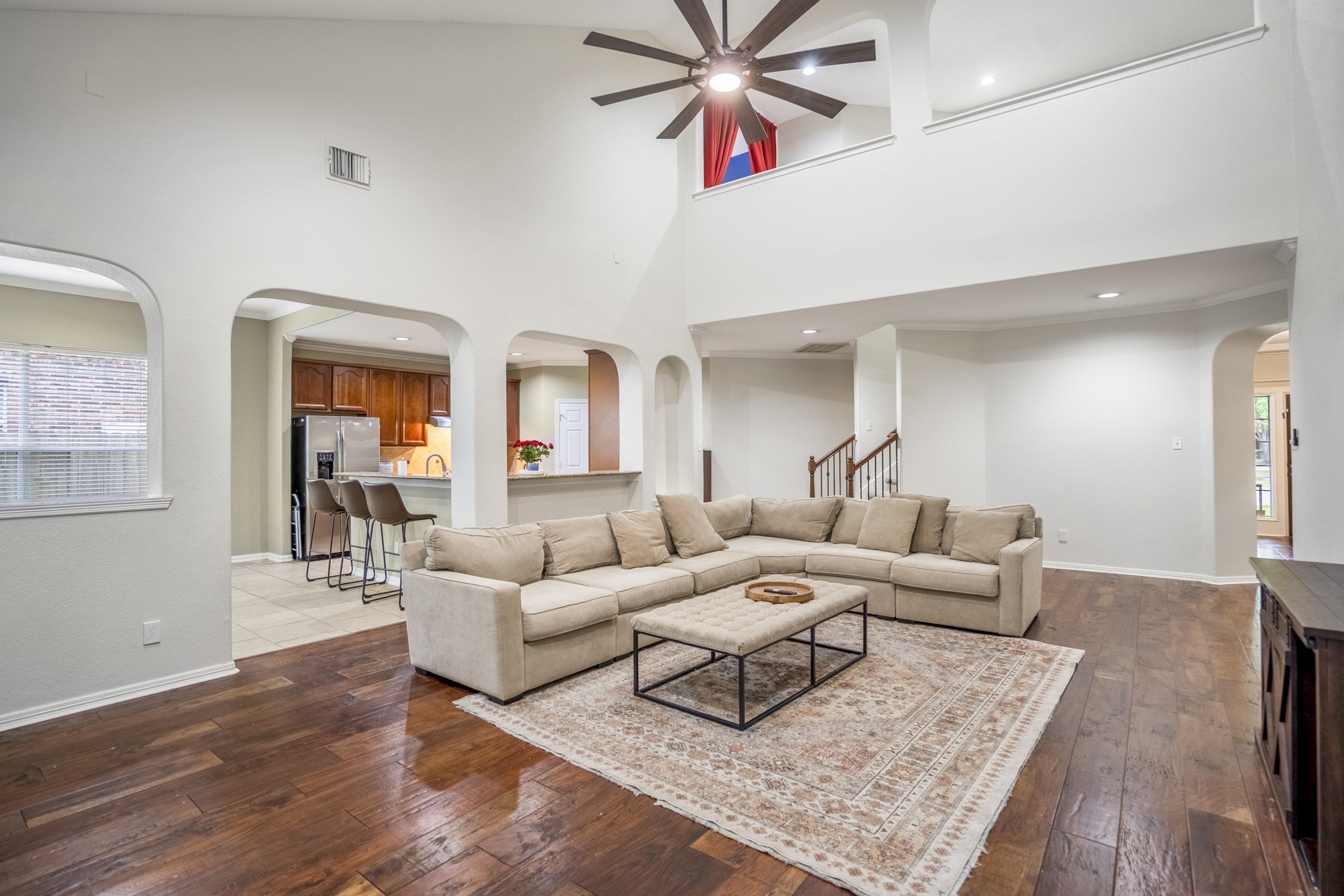10410 Pitcataway Drive Spring, TX 77379 - Photo 11 of 48 The dramatic vaulted ceilings create an open airy atmosphere, while the rich, wide-plank hardwood floors bring a high-end feel to the space.