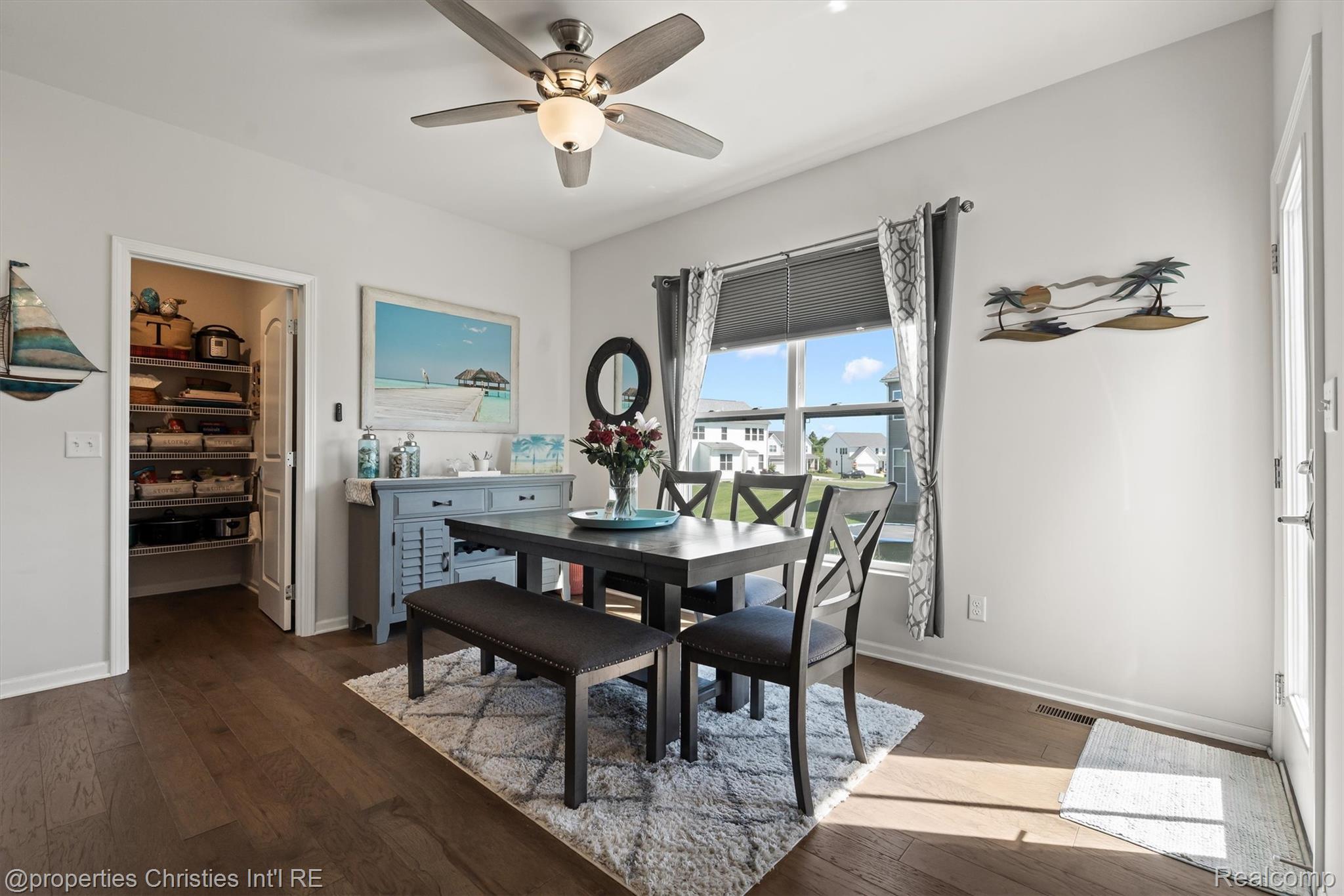 2721 Maize Loop Saline, MI 48176 - Photo 12 of 52 Dining space featuring dark wood-type flooring and a ceiling fan