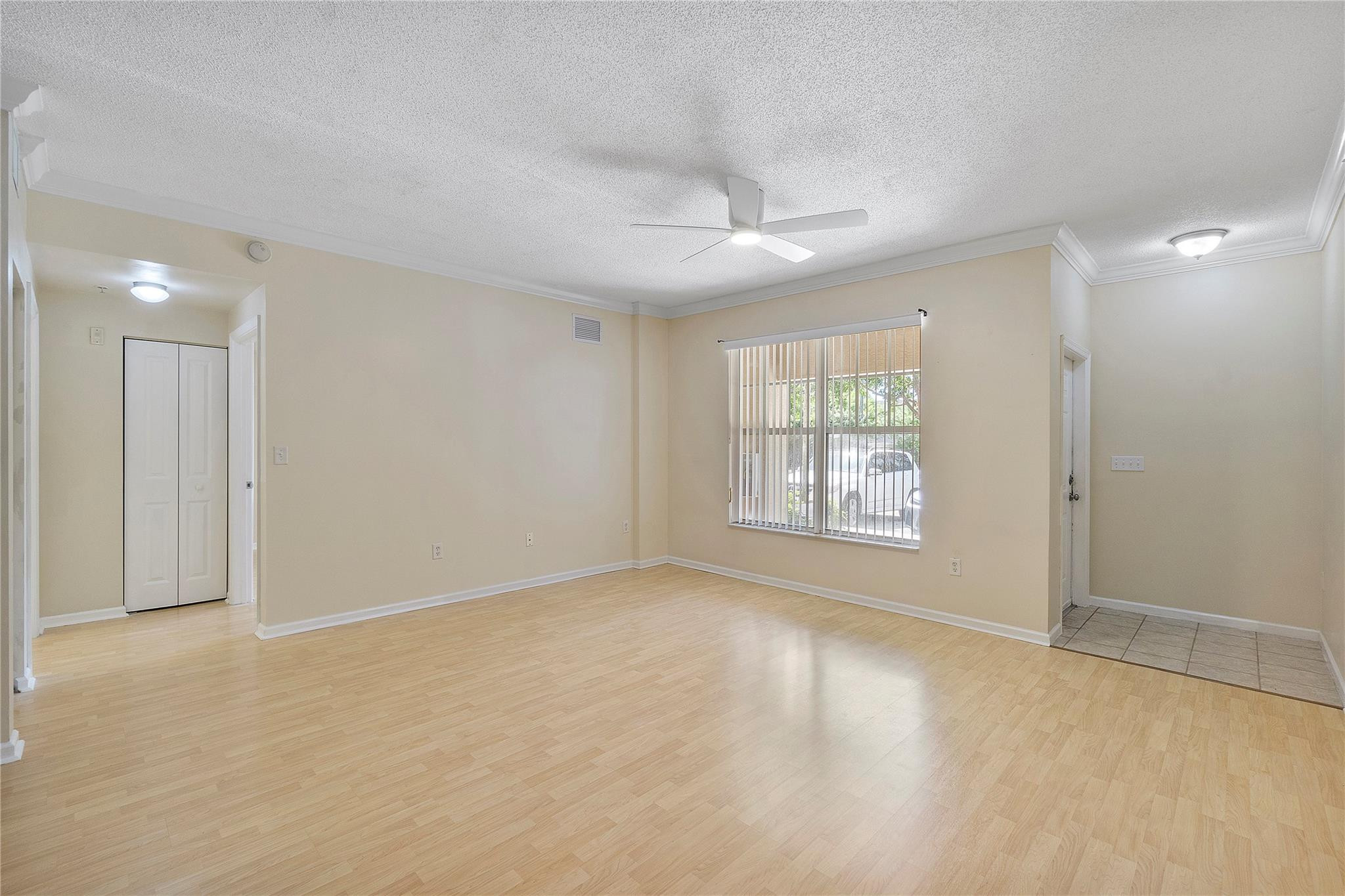 6020 West Sample Road, Unit 103 Coral Springs, FL 33067 - Photo 5 of 20 a view of an empty room with a window