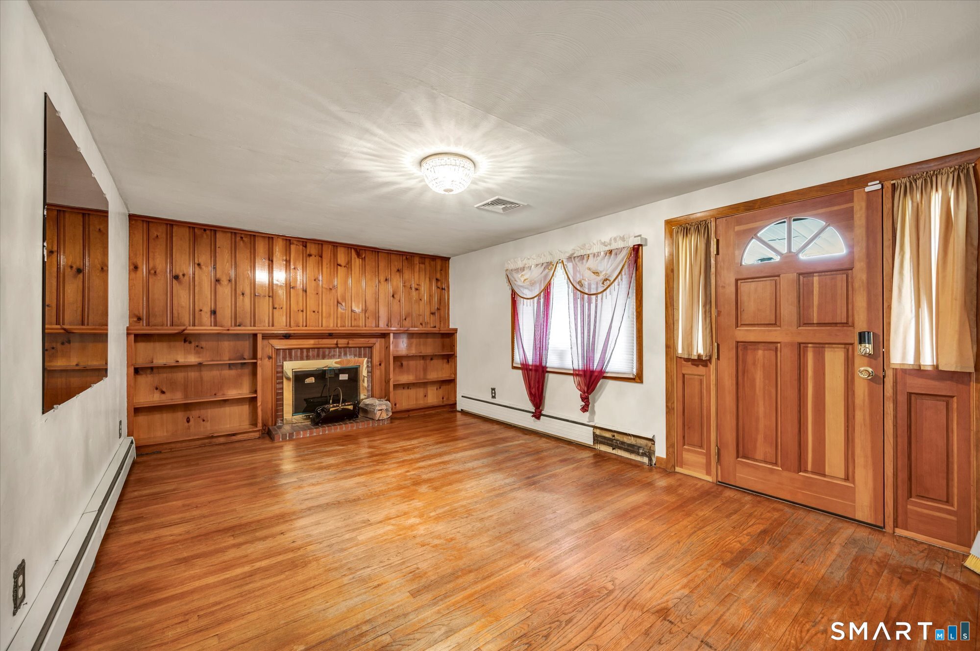 740 Rainbow Road Windsor, CT 06095 - Photo 18 of 40 an empty room with wooden floor and windows
