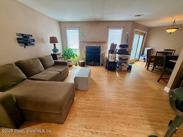 1446 Forest Hill Road, Unit 4 Staten Island, NY 10314 - Photo 14 of 24 a living room with furniture and a fireplace