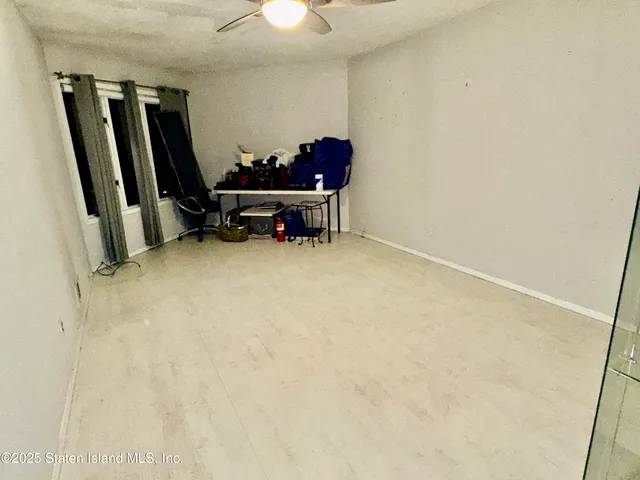 a view of room with furniture and a flat screen tv