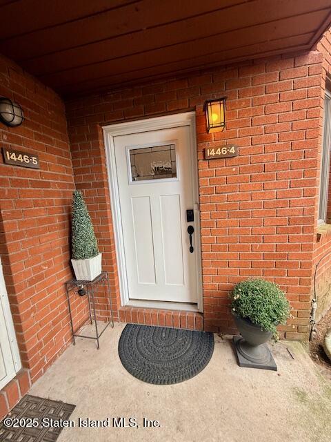 1446 Forest Hill Road, Unit 4 Staten Island, NY 10314 - Photo 2 of 24 a front view of a house