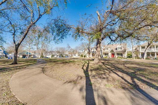 a view of a yard with swimming pool