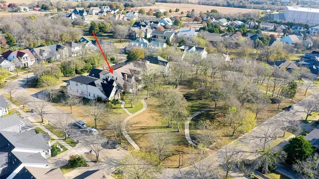 a view of city with snow on the road