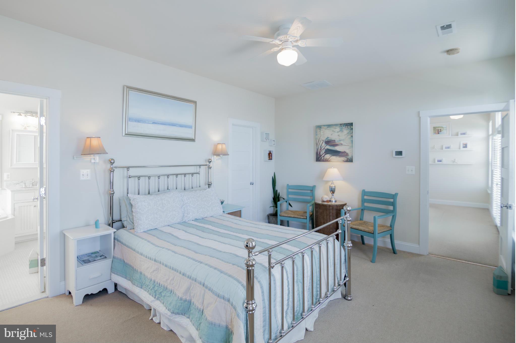 4028 Chesapeake Drive Edgewater, MD 21037 - Photo 11 of 30 a bedroom with a bed and a chandelier