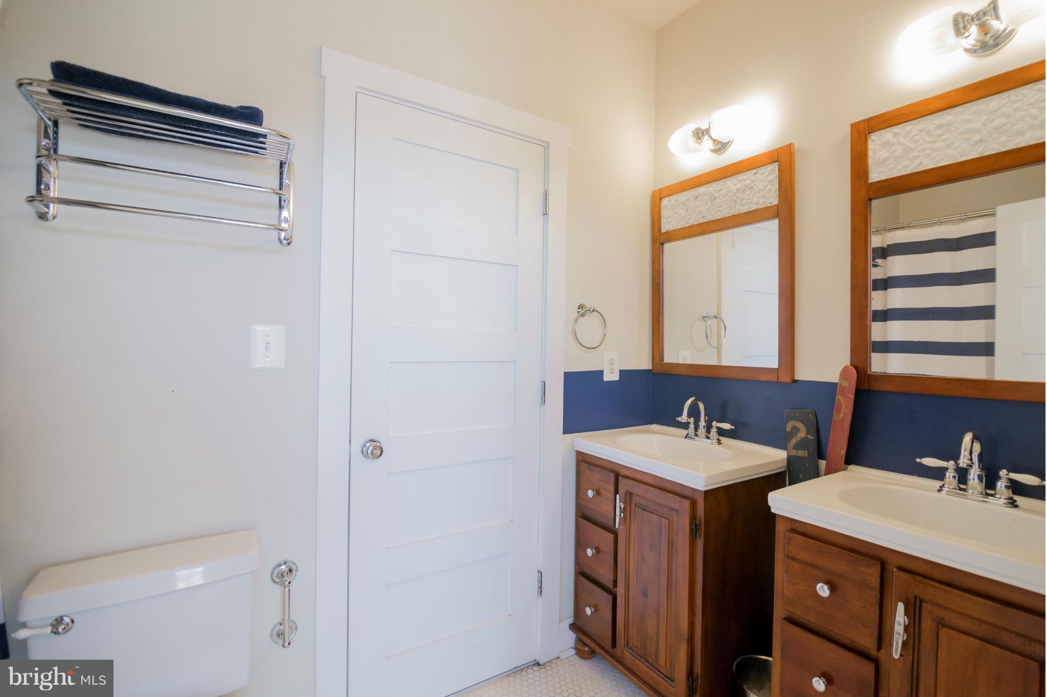 4028 Chesapeake Drive Edgewater, MD 21037 - Photo 16 of 30 a bathroom with a sink and a mirror