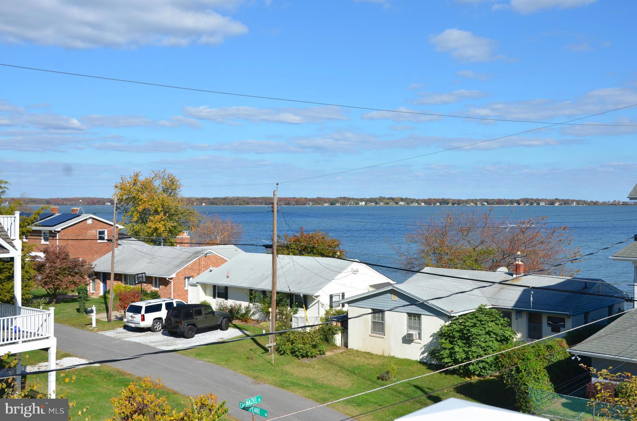 4028 Chesapeake Drive Edgewater, MD 21037 - Photo 19 of 30 a aerial view of a house with swimming pool and lake view