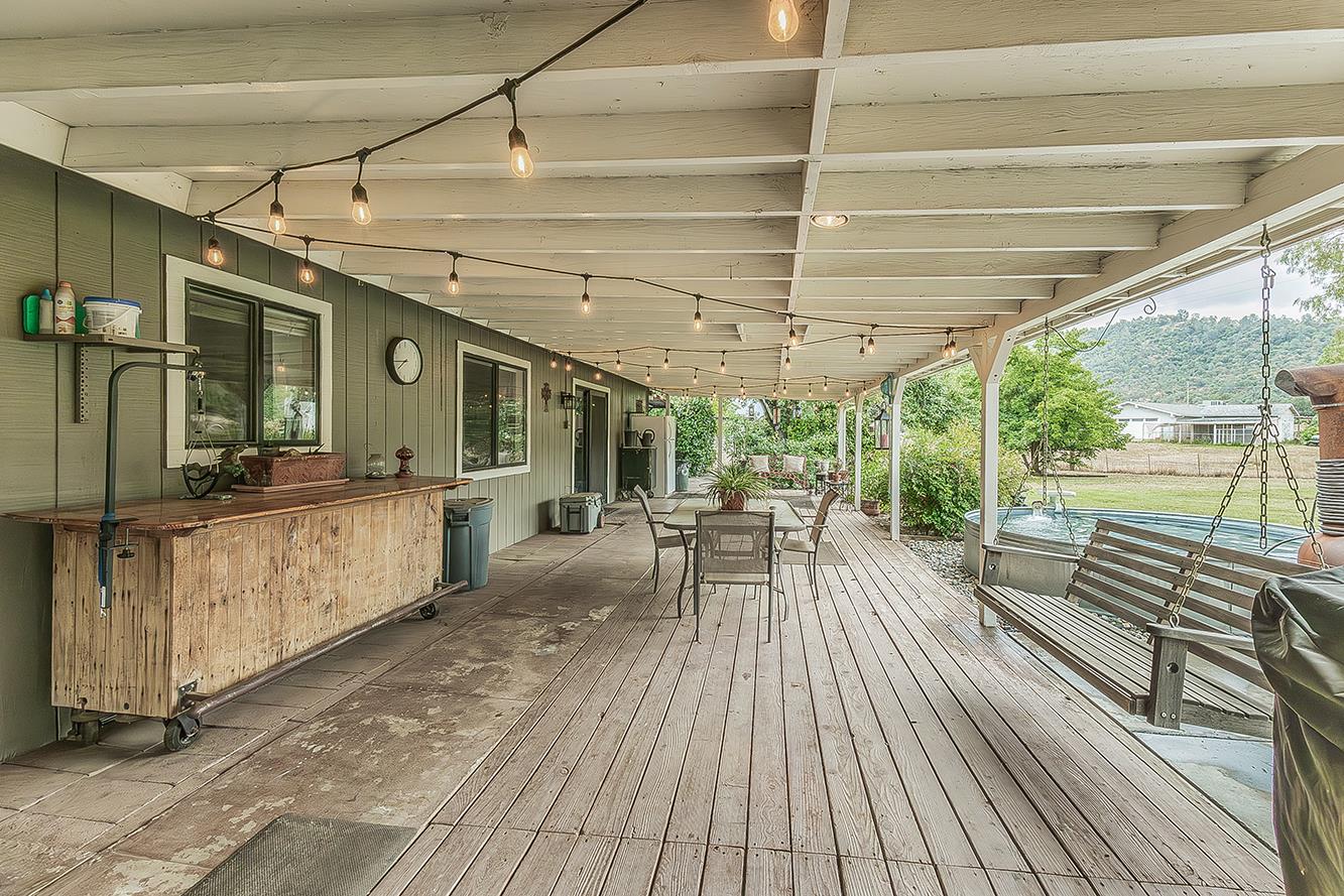 29545 Oak Meadow Road Tollhouse, CA 93667 - Photo 38 of 69 a view of a patio with table and chairs wooden floor and fence