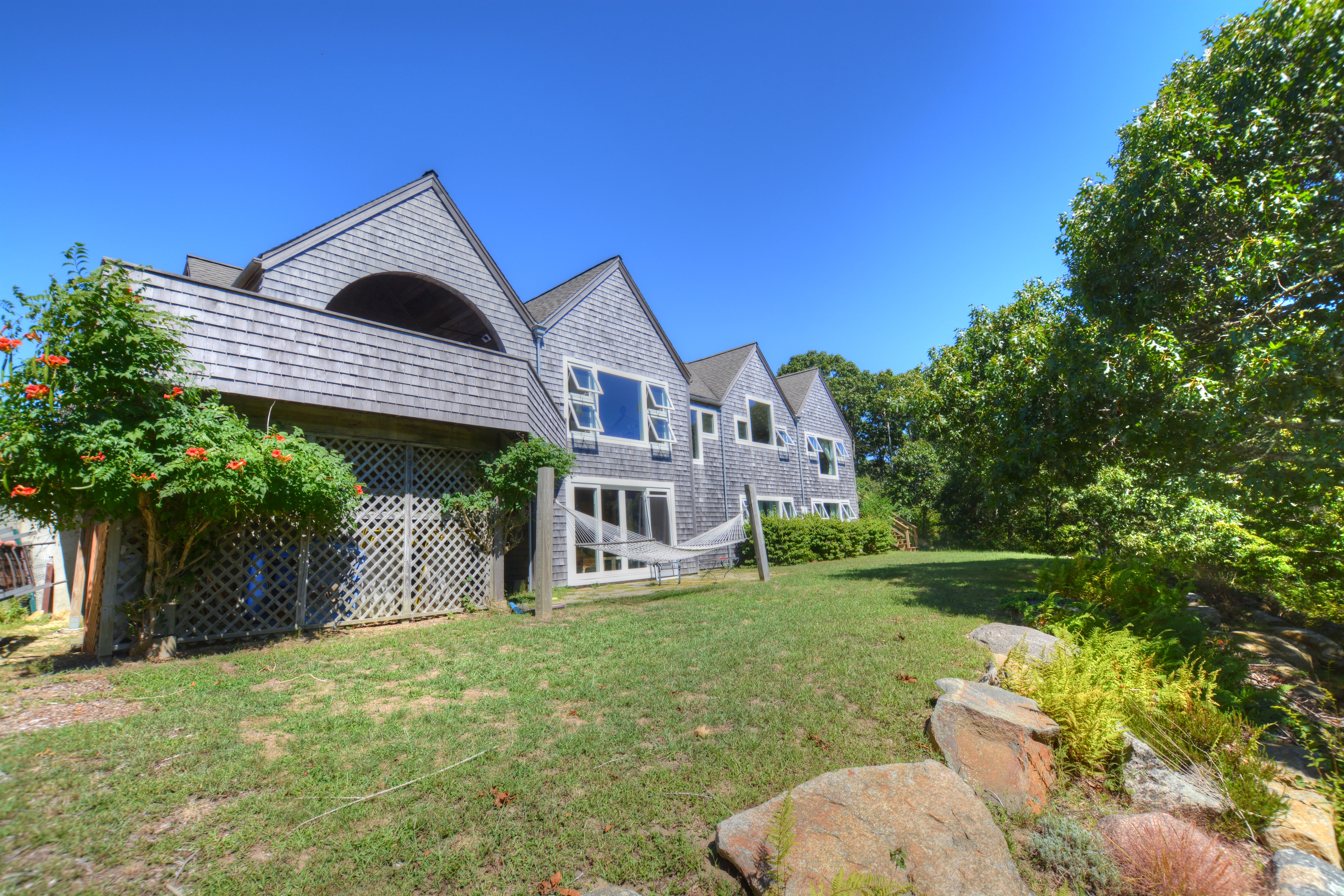 13 Kapigan Road Chilmark, MA 02535 - Photo 2 of 25 a front view of a house with garden