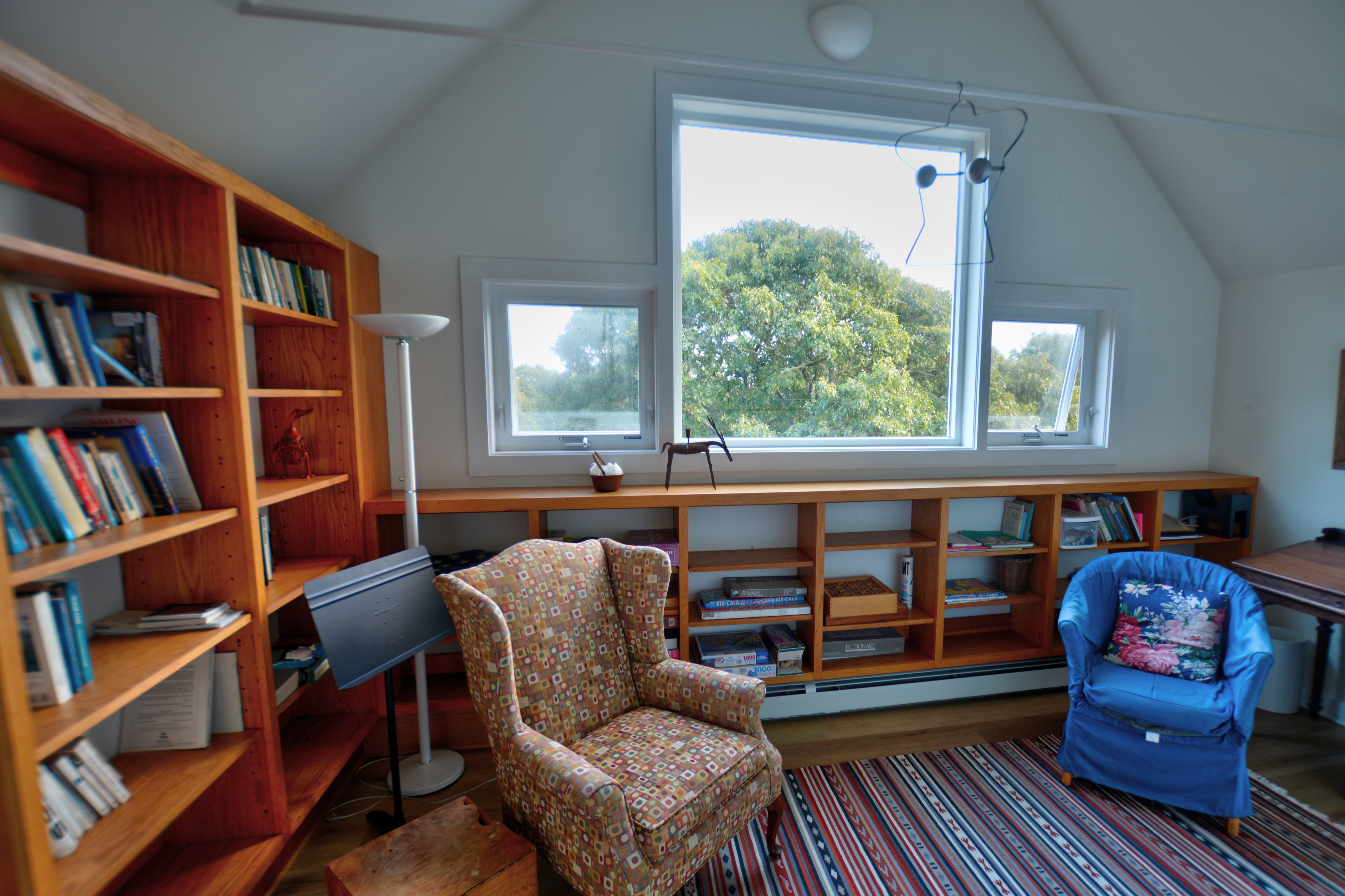 13 Kapigan Road Chilmark, MA 02535 - Photo 14 of 25 a living room with furniture and a book shelf