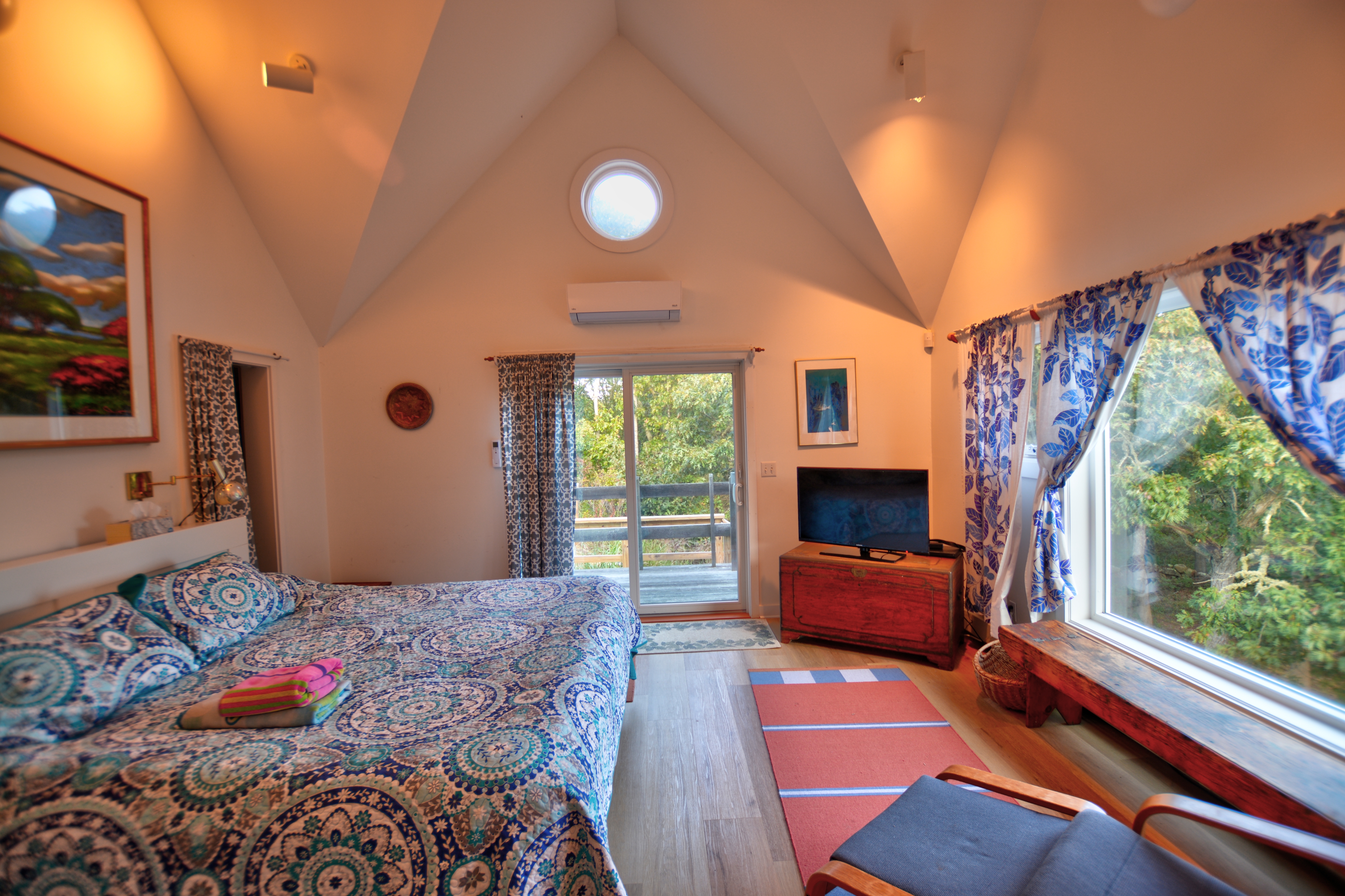 13 Kapigan Road Chilmark, MA 02535 - Photo 17 of 25 a bedroom with a bed and a large window