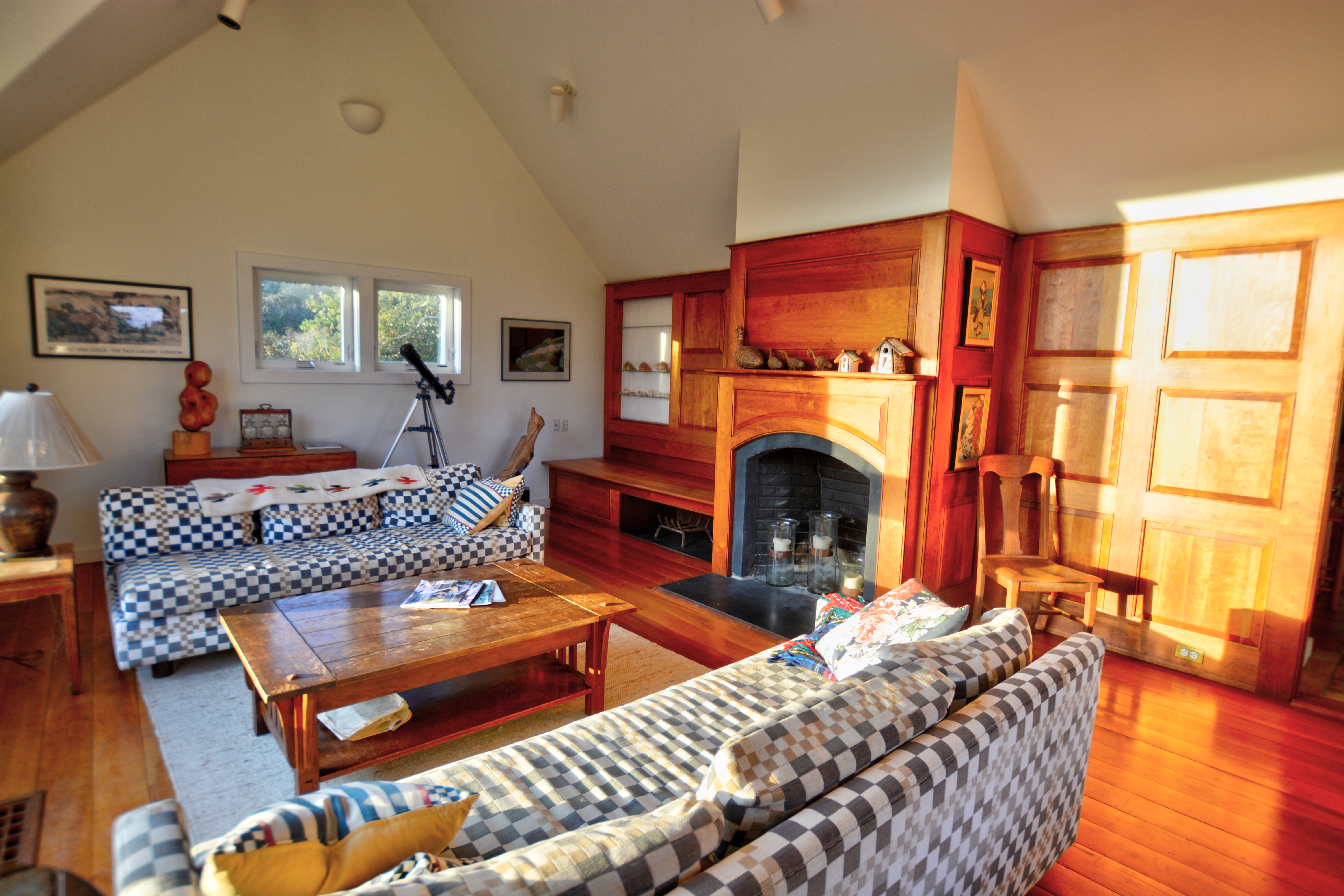 13 Kapigan Road Chilmark, MA 02535 - Photo 6 of 25 a living room with furniture fireplace and a table