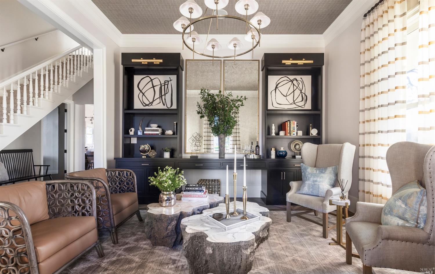 a living room with furniture a clock and a large mirror