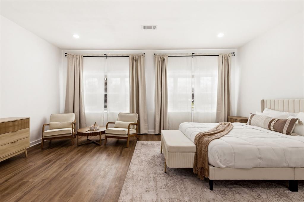 544 West Bethel Road Coppell, TX 75019 - Photo 13 of 19 a bedroom with a bed and a window