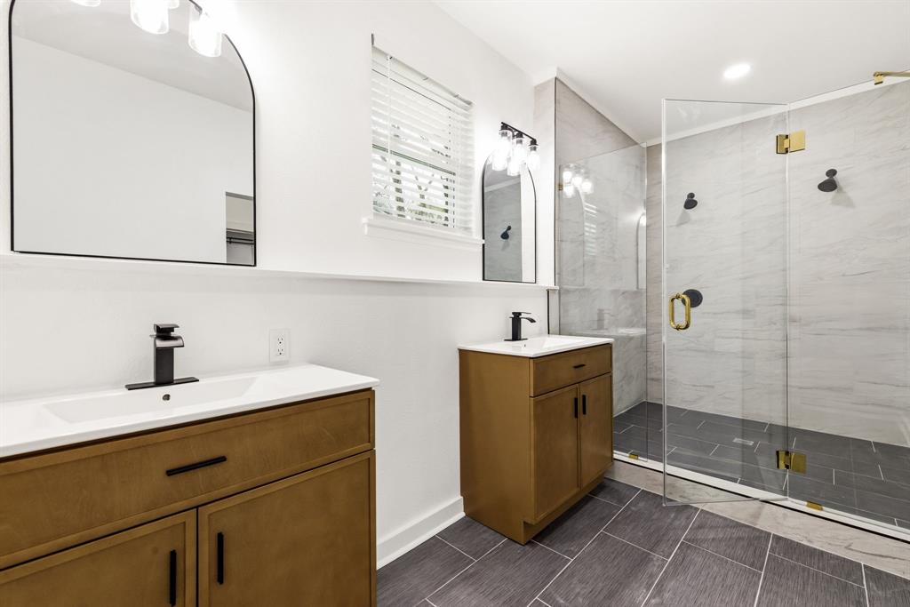 544 West Bethel Road Coppell, TX 75019 - Photo 14 of 19 a bathroom with a double vanity sink mirror and shower