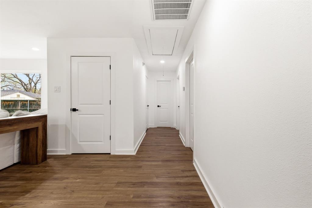 544 West Bethel Road Coppell, TX 75019 - Photo 15 of 19 a view of a hallway with wooden floor and staircase