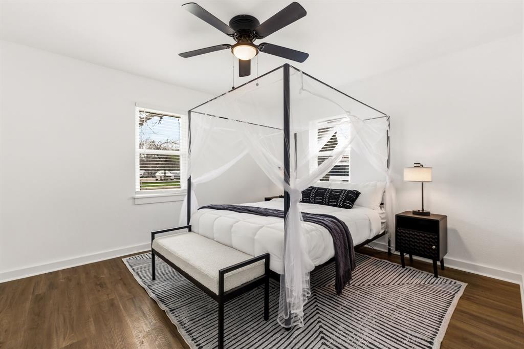 544 West Bethel Road Coppell, TX 75019 - Photo 16 of 19 a bedroom with a bed and wooden floor