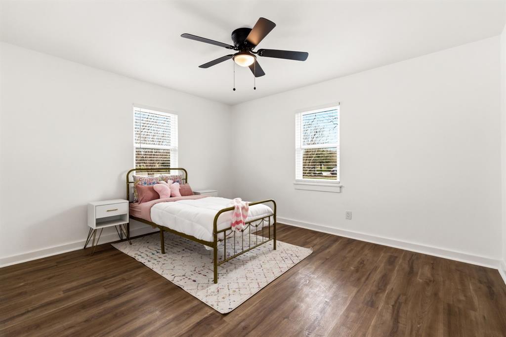 544 West Bethel Road Coppell, TX 75019 - Photo 17 of 19 a living room with a bed furniture and a window