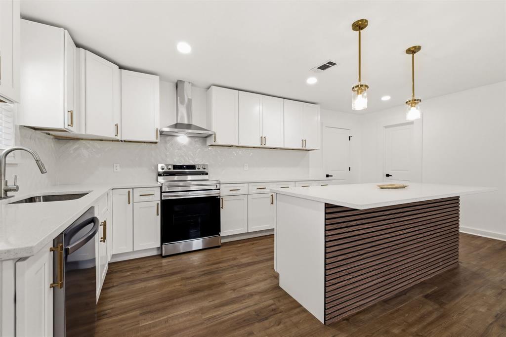 544 West Bethel Road Coppell, TX 75019 - Photo 3 of 19 a kitchen with a sink stainless steel appliances and cabinets