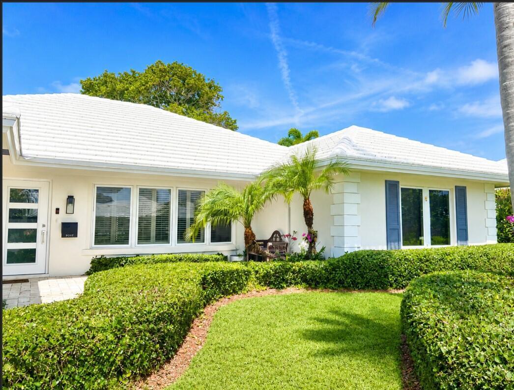 1111 Pepperridge Terrace Boca Raton, FL 33486 - Photo 1 of 8 a view of a white house with a big yard and potted plants