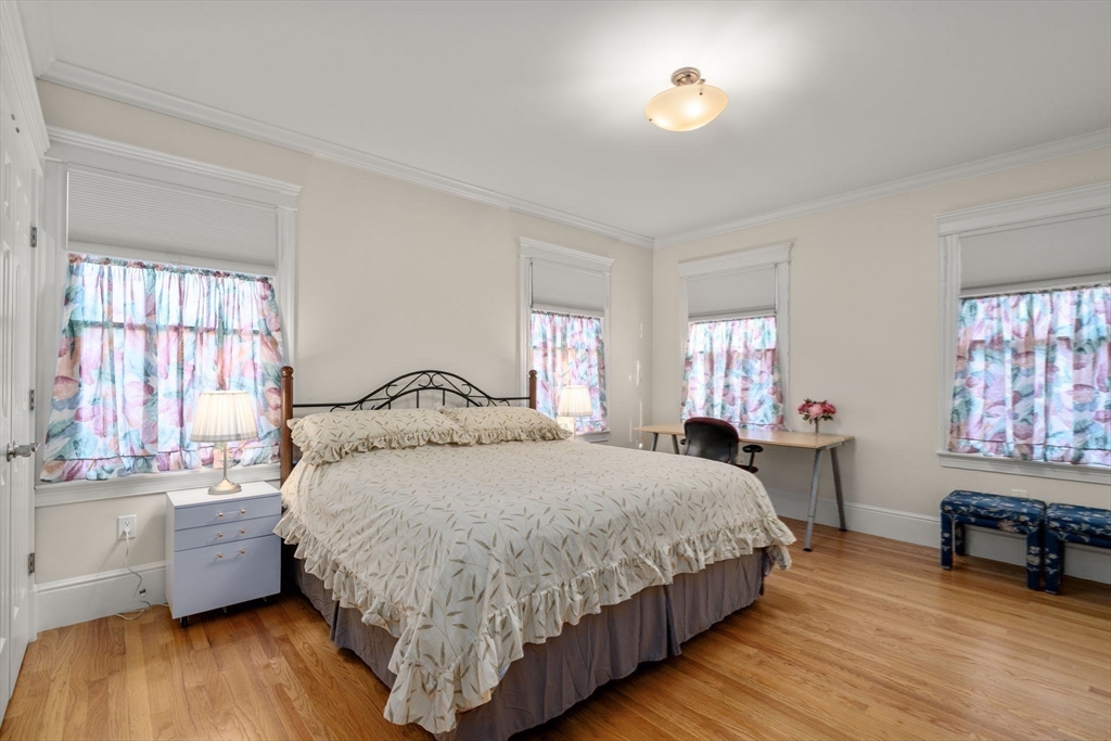 1682 Commonwealth Avenue Newton, MA 02465 - Photo 19 of 35 a bedroom with a bed and a window