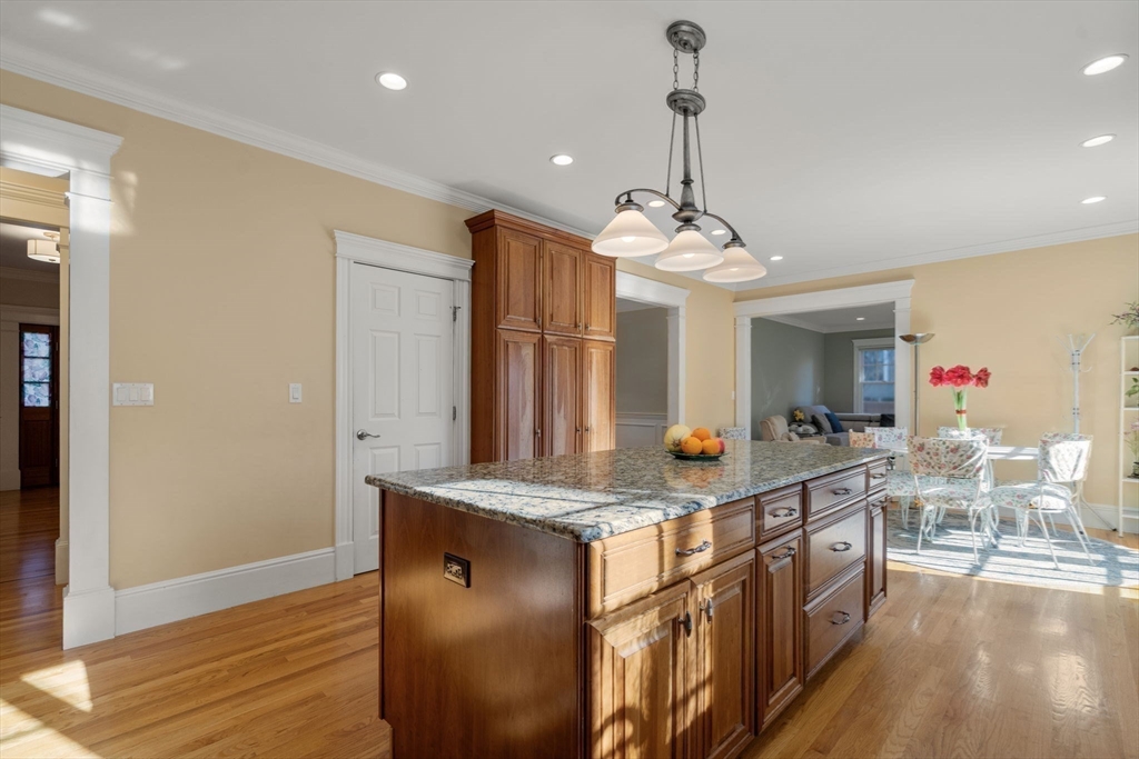 1682 Commonwealth Avenue Newton, MA 02465 - Photo 5 of 35 a kitchen with stainless steel appliances granite countertop a sink cabinets and wooden floor