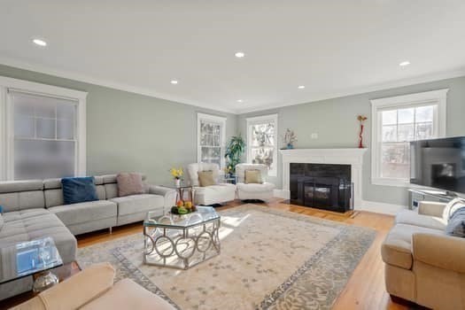 1682 Commonwealth Avenue Newton, MA 02465 - Photo 7 of 35 a living room with furniture and a fireplace