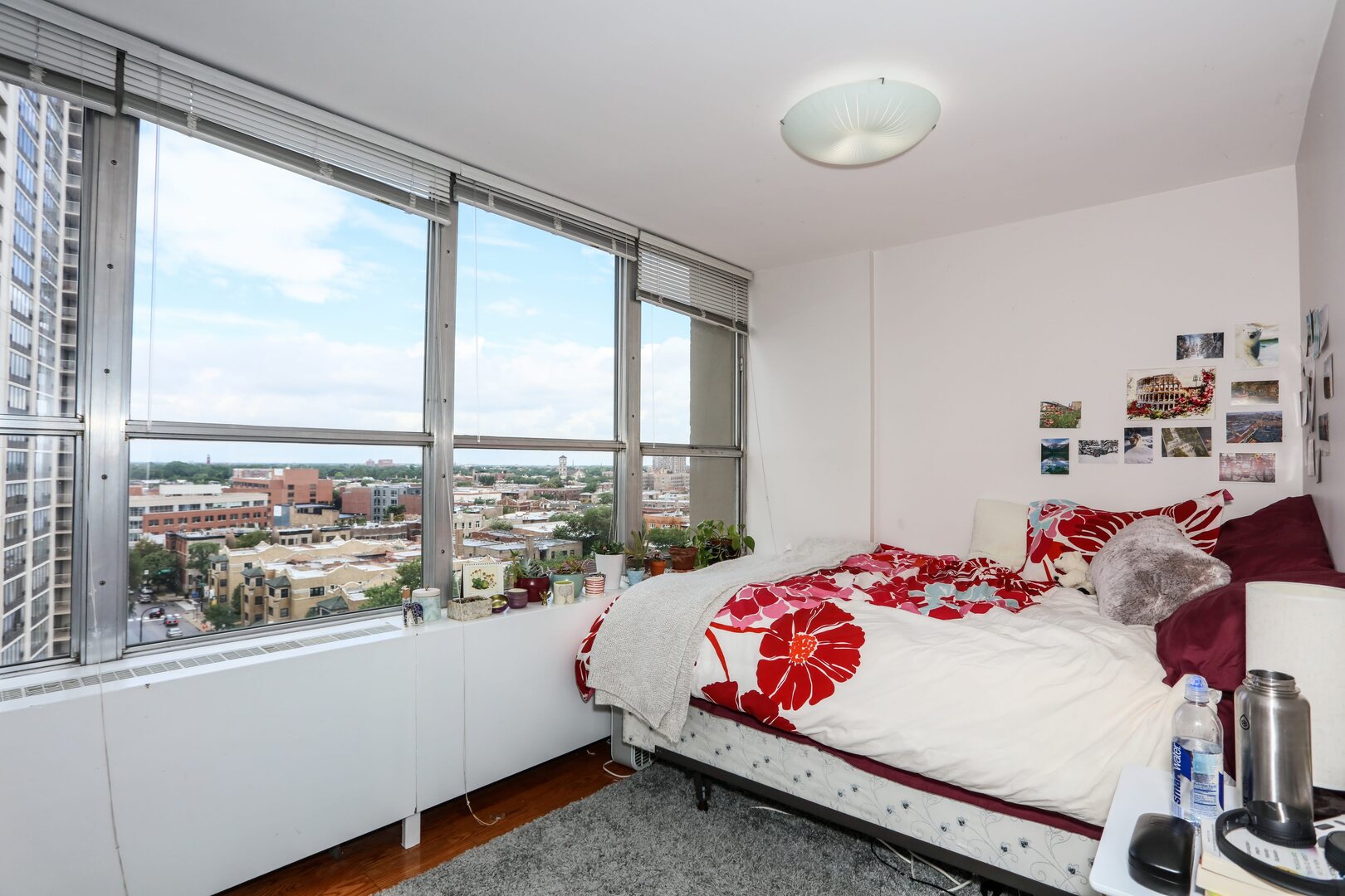 655 West Irving Park Road, Unit 1017 Chicago, IL 60613 - Photo 11 of 24 a bedroom with a bed and a window